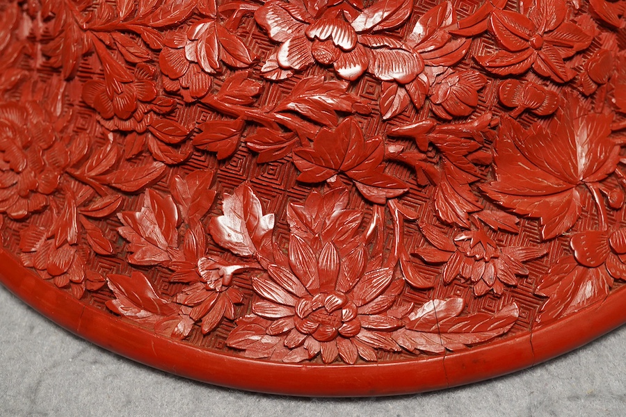 An unusual Chinese cinnabar lacquer ‘thousand flower’ footed dish, 18th/19th century